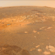 A shot from Perseverance’s roost in Jezero, with rover tracks at bottom.